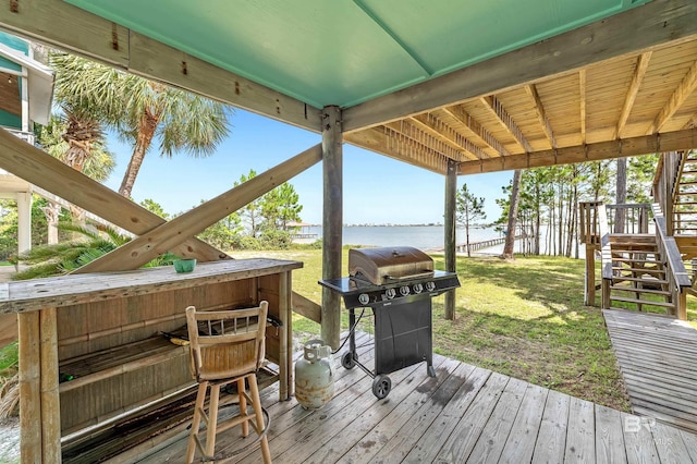 14752 State Highway 180, Gulf Shores, AL 36542 - deck featuring stairway, grilling area, a water view, and a yard