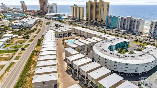 birds eye view of property with a city view and a water view