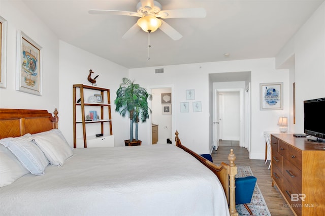 bedroom featuring hardwood / wood-style flooring and ceiling fan