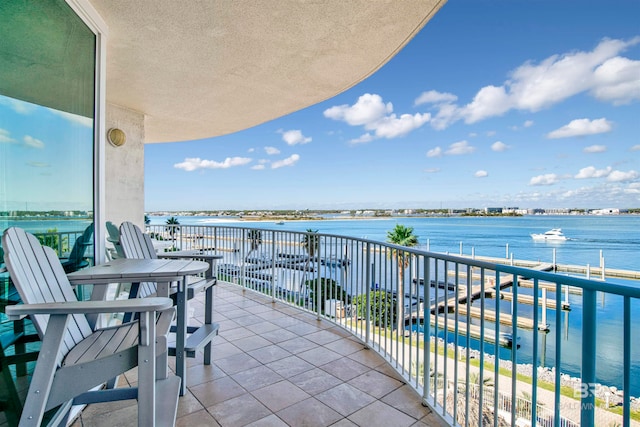 balcony featuring a water view