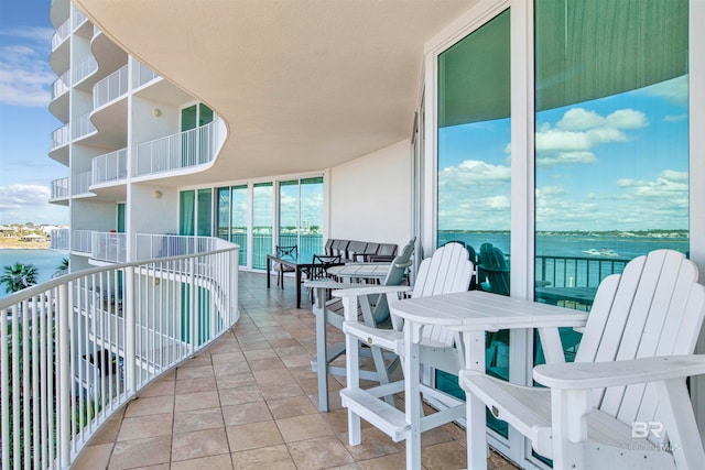 balcony featuring a water view