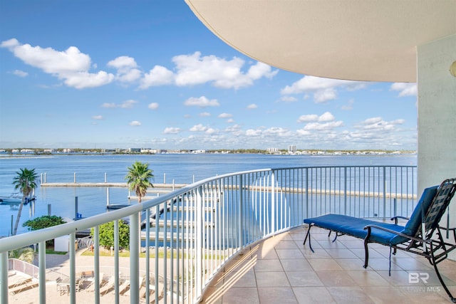 balcony featuring a water view