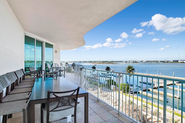 balcony featuring a water view