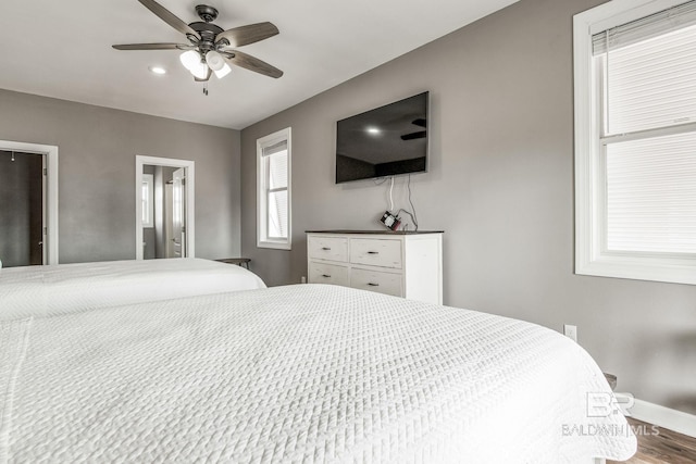 bedroom featuring ceiling fan and wood-type flooring