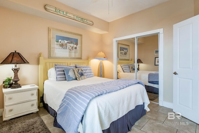 tiled bedroom featuring a closet