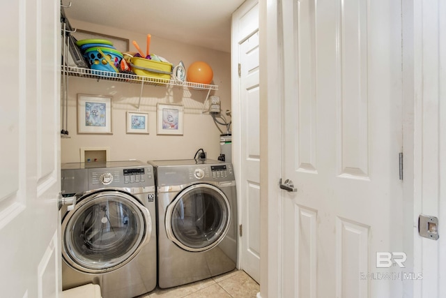 laundry area featuring washer and dryer and tile patterned floors