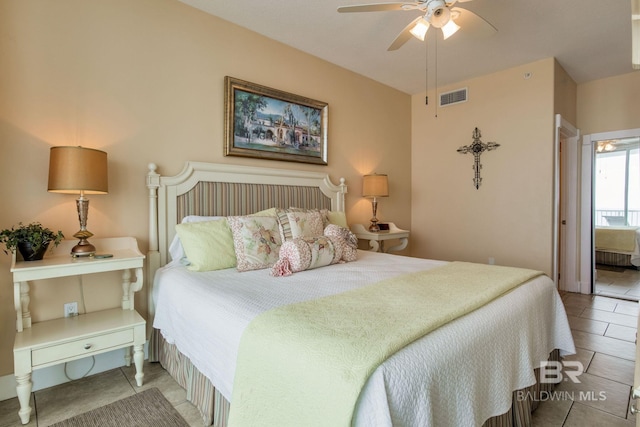 bedroom featuring a ceiling fan, visible vents, and tile patterned floors