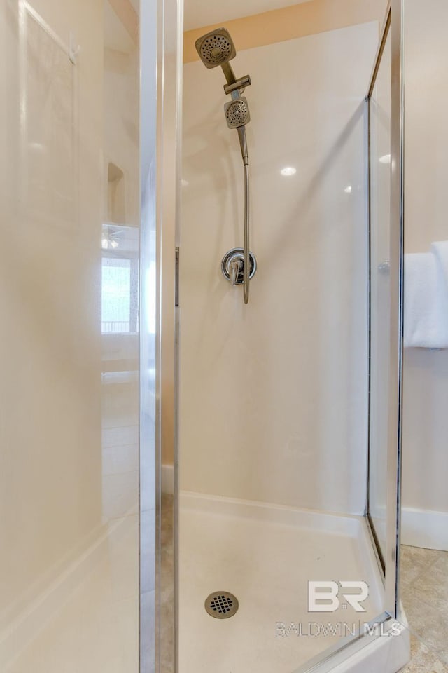 full bathroom with a shower stall