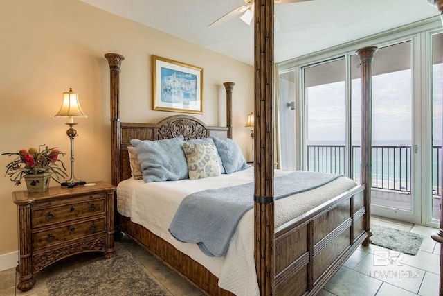 bedroom with access to outside, multiple windows, and tile patterned flooring