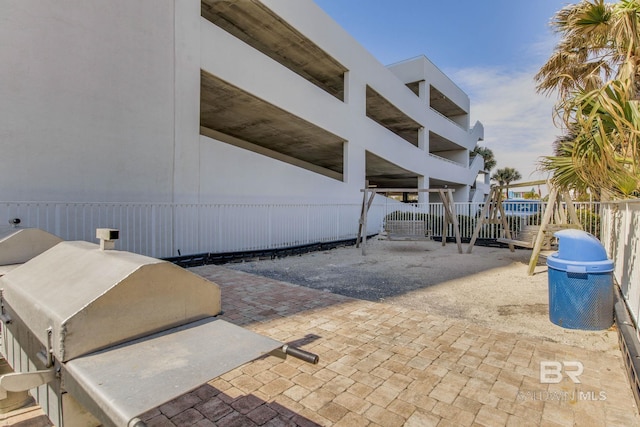 view of patio / terrace featuring fence