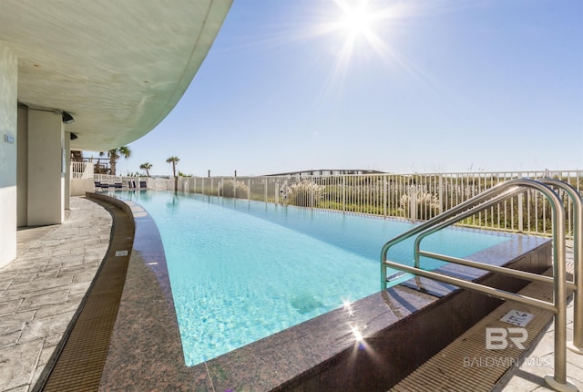 view of pool with a fenced in pool