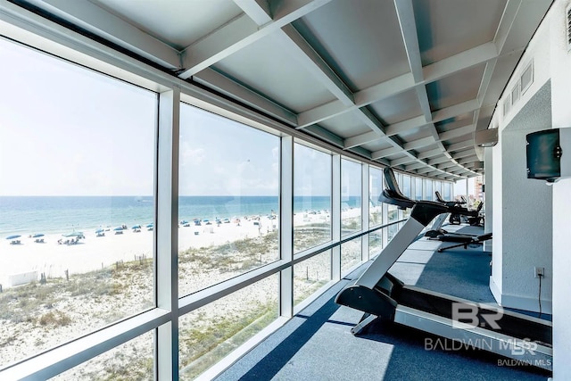 interior space featuring a beach view, coffered ceiling, and beam ceiling