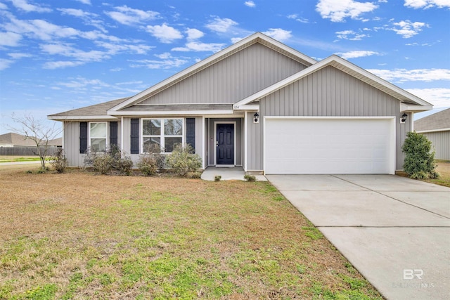 view of front of home featuring a garage and a front lawn