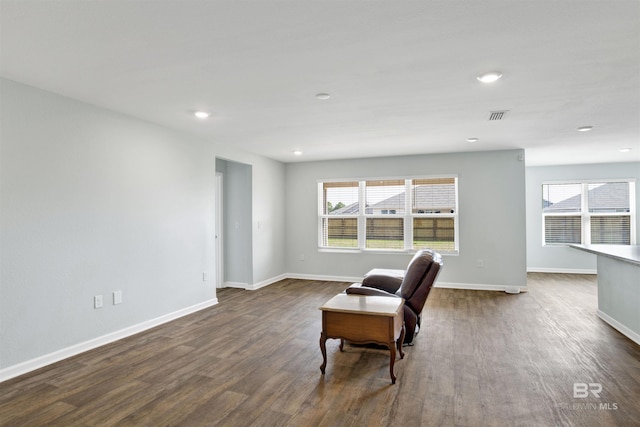 living area featuring dark hardwood / wood-style floors