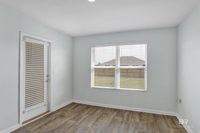 unfurnished room featuring hardwood / wood-style flooring