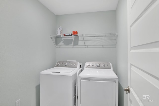 washroom with washer and clothes dryer