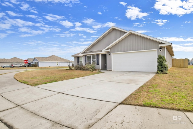 view of front of house with a garage and a front yard