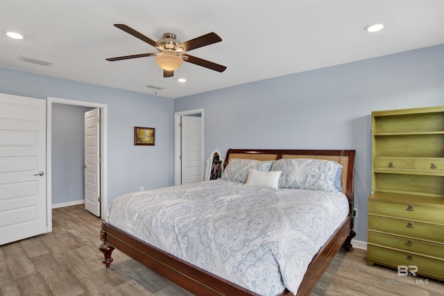 bedroom featuring wood-type flooring and ceiling fan