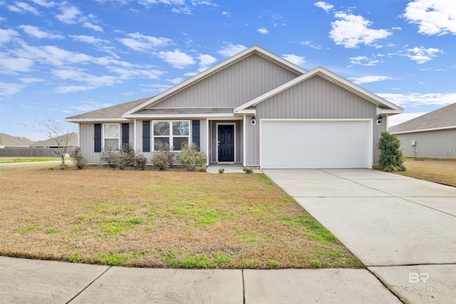 view of front of house featuring a garage and a front yard