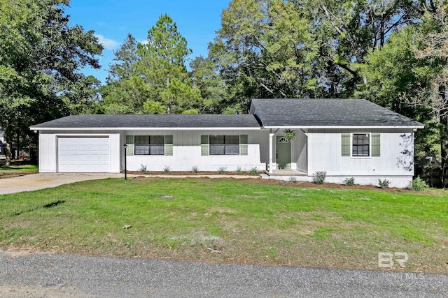 ranch-style house featuring a garage and a front yard