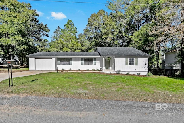 ranch-style home with a front yard and a garage