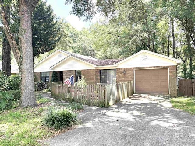 513 3rd St, Fairhope, AL 36532 - ranch-style home with a garage, brick siding, and driveway