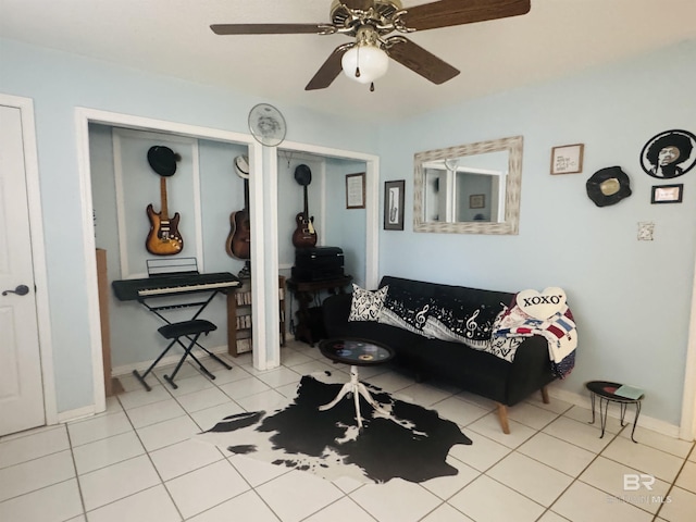 513 3rd St, Fairhope, AL 36532 - tiled living room with a ceiling fan and baseboards