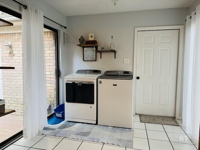 513 3rd St, Fairhope, AL 36532 - washroom with independent washer and dryer, light tile patterned floors, and plenty of natural light