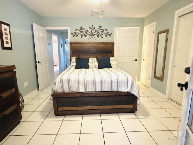 513 3rd St, Fairhope, AL 36532 - bedroom with light tile patterned floors and baseboards