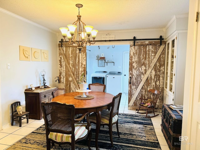 513 3rd St, Fairhope, AL 36532 - dining space featuring independent washer and dryer, a barn door, light tile patterned flooring, a chandelier, and ornamental molding