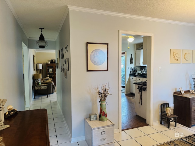513 3rd St, Fairhope, AL 36532 - corridor with crown molding, light tile patterned flooring, and a textured ceiling