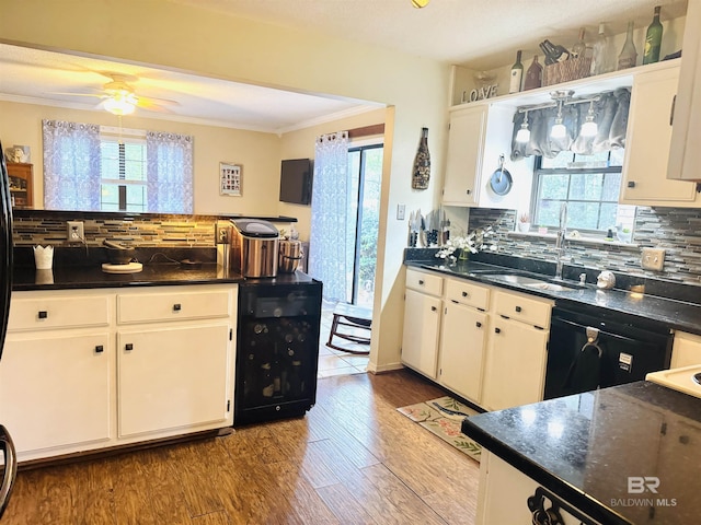 513 3rd St, Fairhope, AL 36532 - kitchen featuring a ceiling fan, dark countertops, healthy amount of natural light, and crown molding