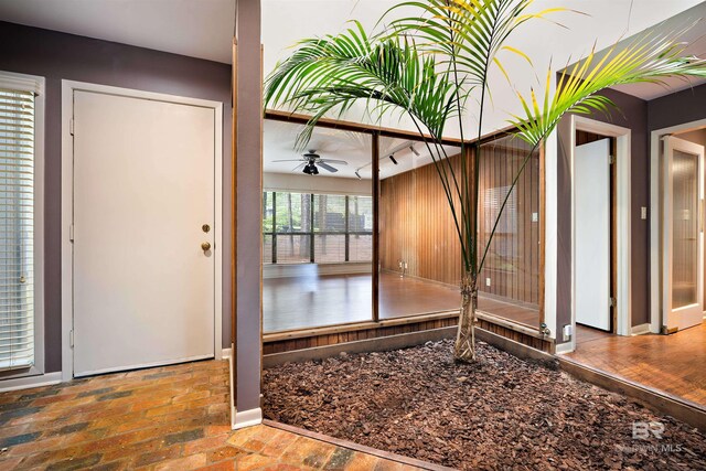 6 Pirates Ln, Spanish Fort, AL 36527 - foyer featuring a ceiling fan and brick flooring