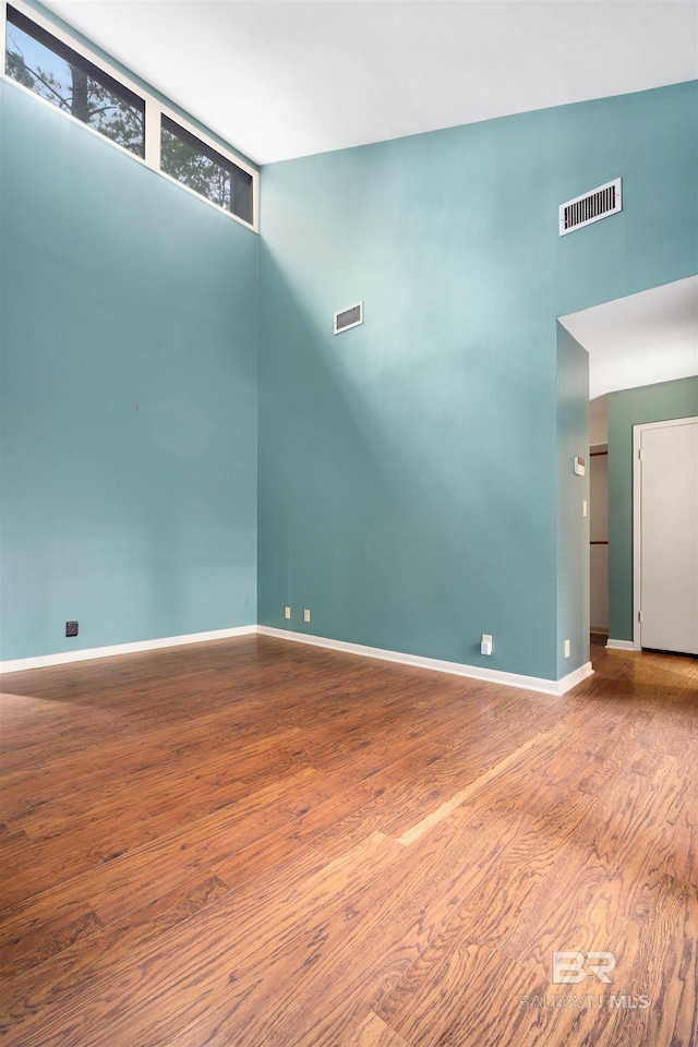 6 Pirates Ln, Spanish Fort, AL 36527 - unfurnished room featuring wood finished floors and a high ceiling