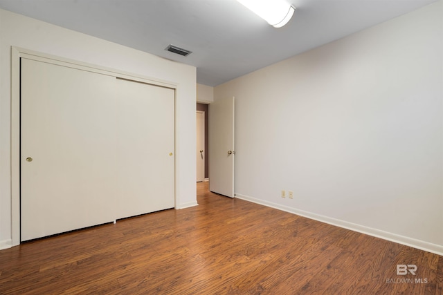 6 Pirates Ln, Spanish Fort, AL 36527 - unfurnished bedroom with wood finished floors and a closet