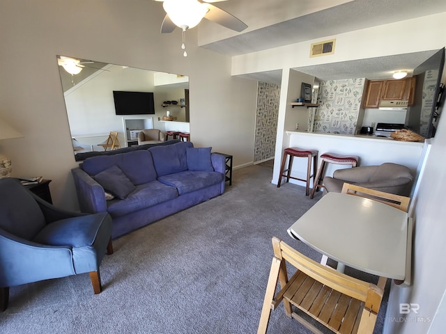 living room featuring carpet flooring and ceiling fan