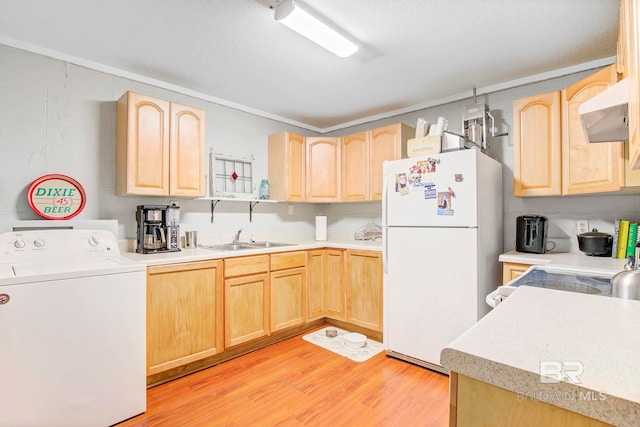 651 Olive Ave, Fairhope, AL 36532 - kitchen with washer / dryer, light brown cabinetry, freestanding refrigerator, and a textured ceiling