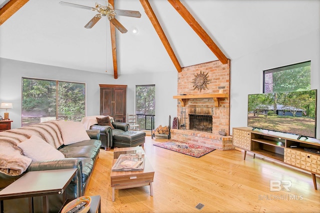 651 Olive Ave, Fairhope, AL 36532 - living area featuring high vaulted ceiling, beam ceiling, a brick fireplace, a ceiling fan, and wood finished floors