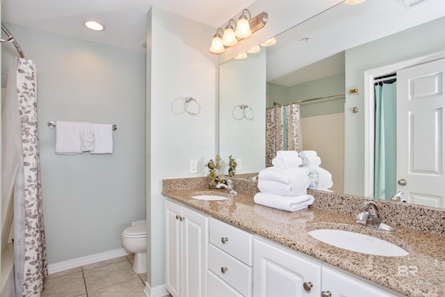 bathroom featuring vanity, toilet, a shower with shower curtain, and tile patterned flooring