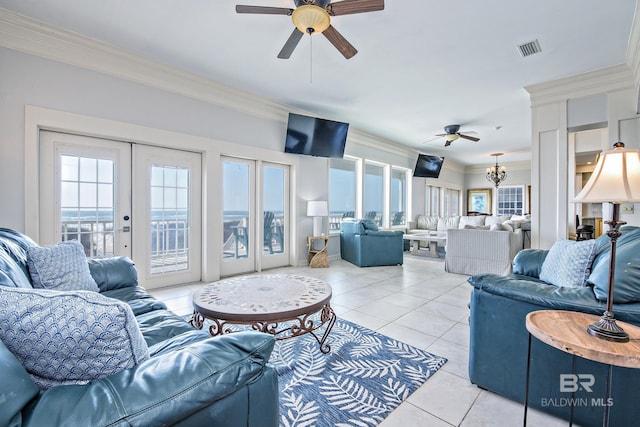 living room featuring visible vents, ornamental molding, ceiling fan with notable chandelier, french doors, and light tile patterned flooring