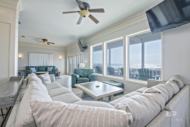 living area featuring ornamental molding, a ceiling fan, and light tile patterned floors