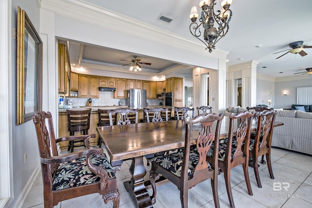 dining room featuring baseboards, visible vents, ceiling fan, crown molding, and light tile patterned flooring