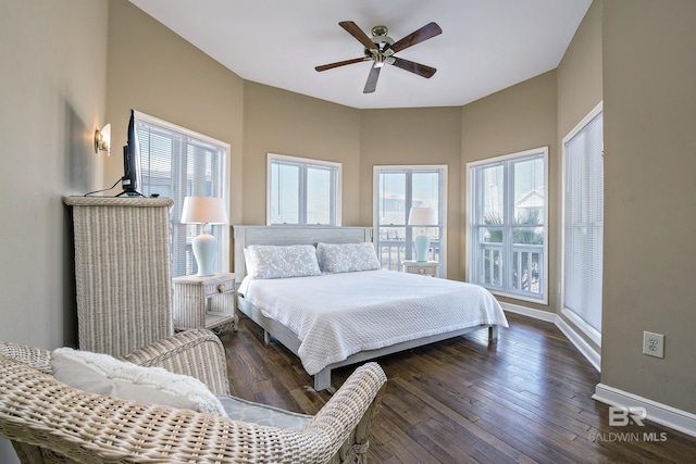 bedroom with dark wood-style floors, ceiling fan, and baseboards