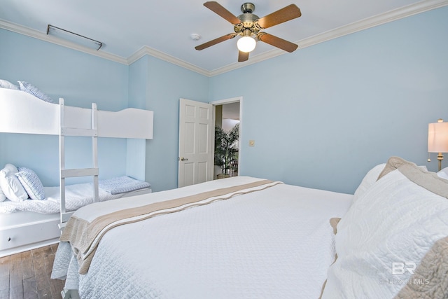 bedroom featuring dark wood-style floors, ceiling fan, and ornamental molding