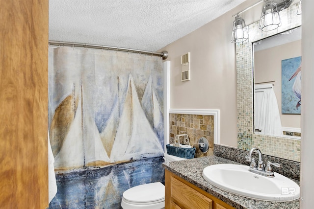 409 E Beach Blvd Unit 184, Gulf Shores, AL 36542 - full bath featuring vanity, toilet, backsplash, a textured ceiling, and a shower with shower curtain