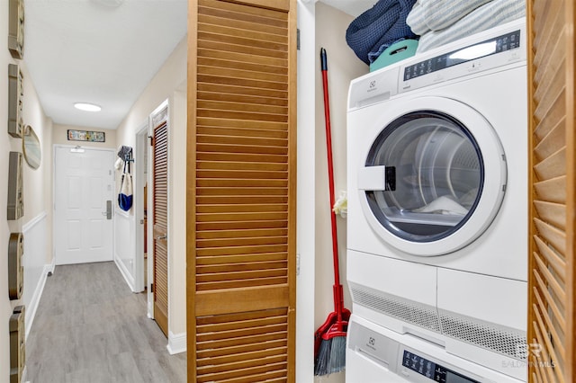 409 E Beach Blvd Unit 184, Gulf Shores, AL 36542 - laundry room with stacked washer / dryer and wood finished floors