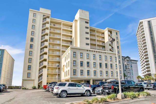 409 E Beach Blvd Unit 184, Gulf Shores, AL 36542 - view of apartment building / complex featuring uncovered parking