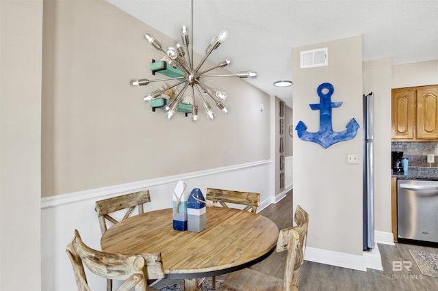 409 E Beach Blvd Unit 184, Gulf Shores, AL 36542 - dining room with a chandelier, wood finished floors, and baseboards