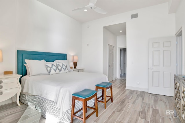 bedroom featuring ceiling fan and light hardwood / wood-style flooring