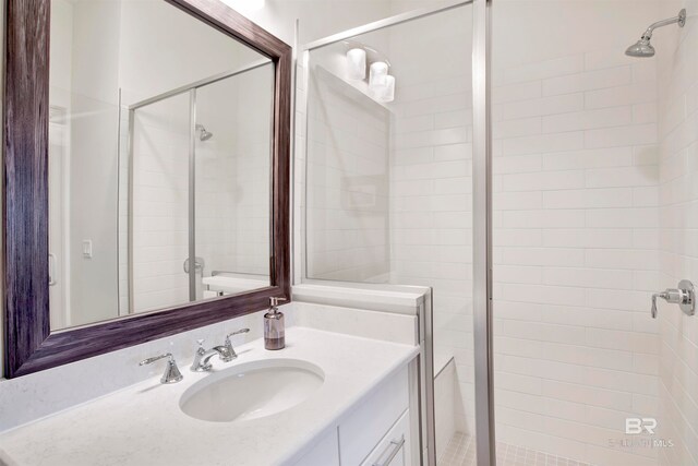 bathroom featuring vanity and an enclosed shower